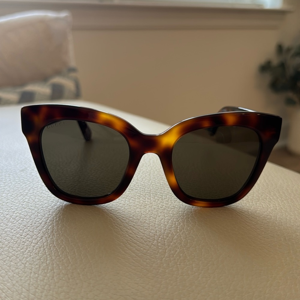 Authentic Gucci sunglasses.  Never worn.  Excellent condition.  Tortoise color.